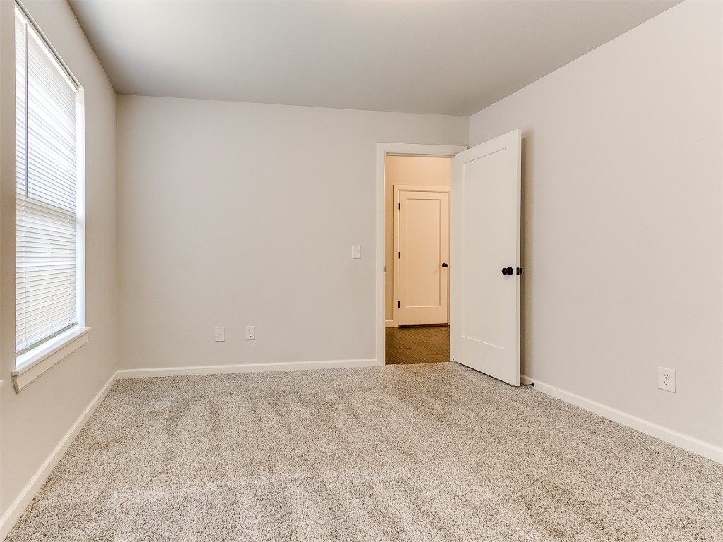 6604 NW 155th Street, Edmond, OK 73013 unfurnished room featuring light hardwood / wood-style floors