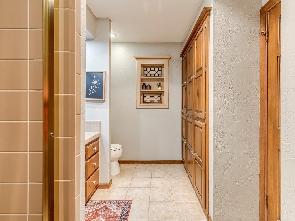 11425 Robinwood Lane, Oklahoma City, OK 73131 bathroom featuring toilet, vanity, and tile flooring