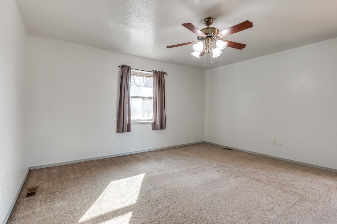1310 Choctaw Trail, Blanchard, OK 73010 spare room with ceiling fan and carpet