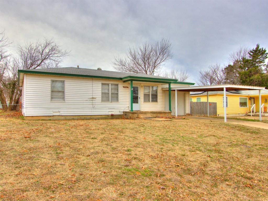 9312 NE 13th Street, Midwest City, OK 73130 ranch-style house with a front yard