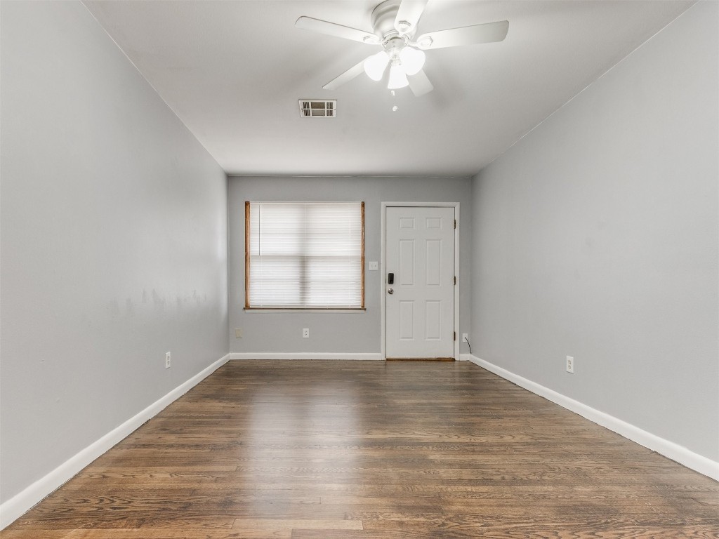 9312 NE 13th Street, Midwest City, OK 73130 unfurnished room with dark hardwood / wood-style flooring and ceiling fan