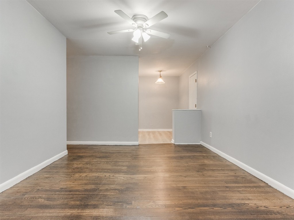 9312 NE 13th Street, Midwest City, OK 73130 spare room featuring dark wood-type flooring and ceiling fan