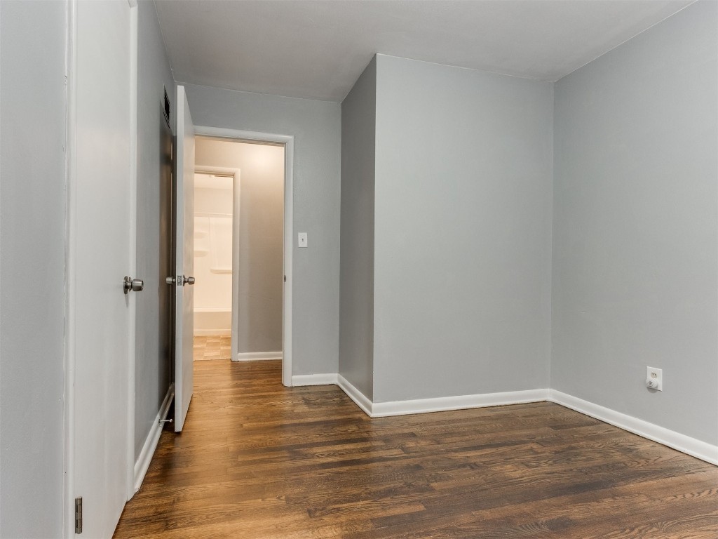 9312 NE 13th Street, Midwest City, OK 73130 unfurnished room with dark hardwood / wood-style flooring