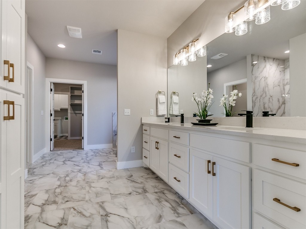 3032 Hunter Crest Drive, Edmond, OK 73034 bathroom with double vanity and tile floors