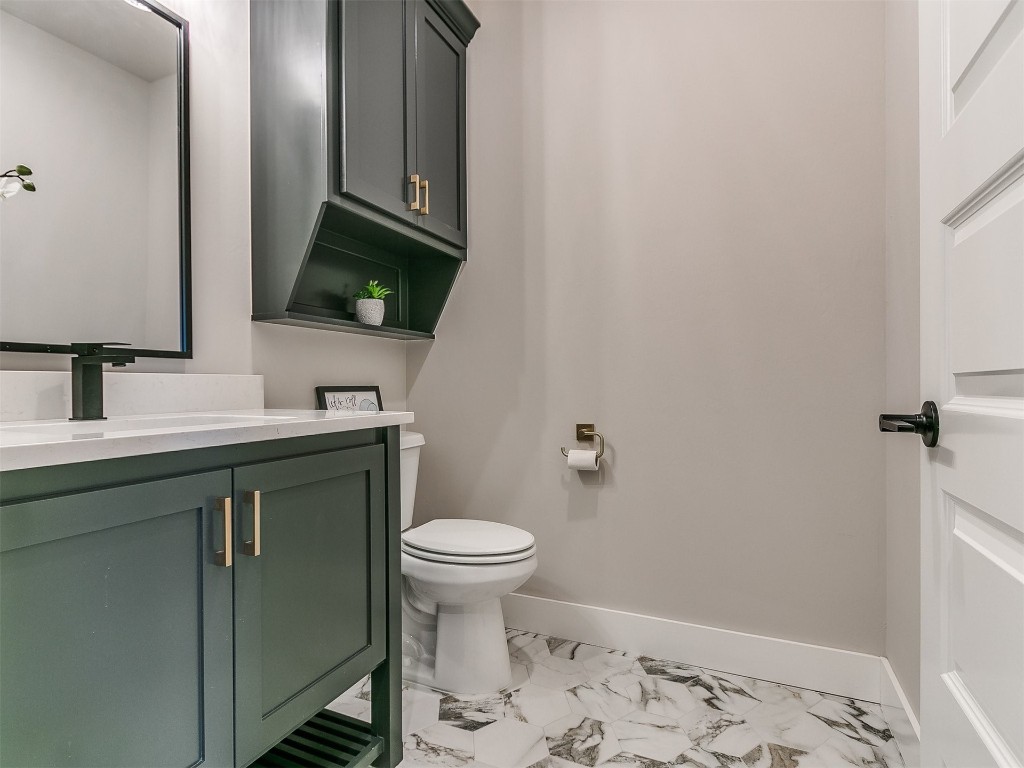 3032 Hunter Crest Drive, Edmond, OK 73034 bathroom with vanity, toilet, and tile floors