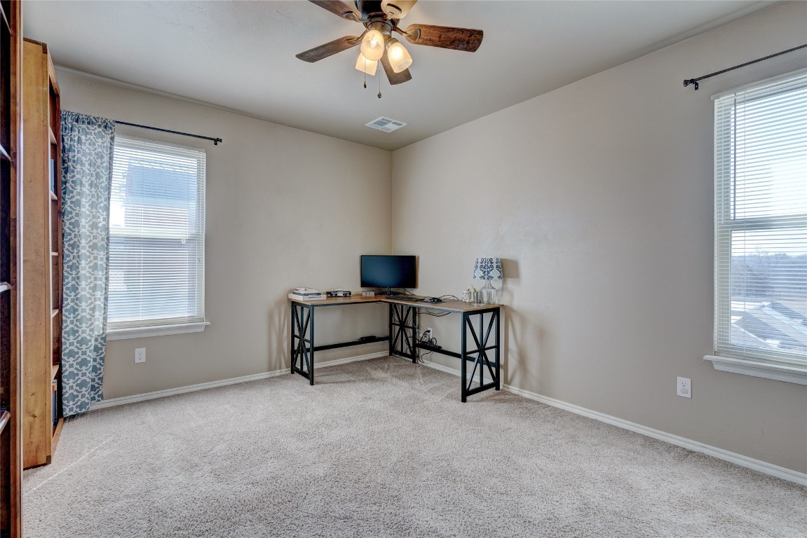 145 Oakridge Drive, Choctaw, OK 73020 carpeted home office featuring plenty of natural light and ceiling fan