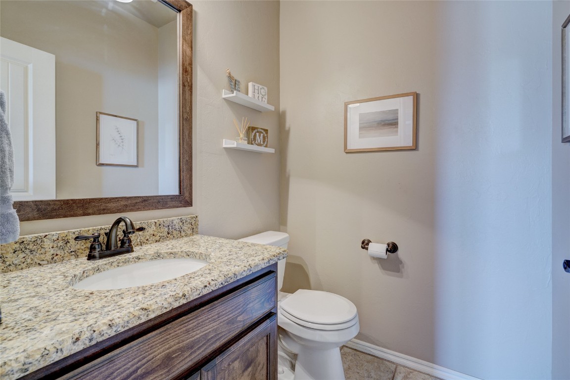 145 Oakridge Drive, Choctaw, OK 73020 bathroom featuring toilet, large vanity, and tile floors