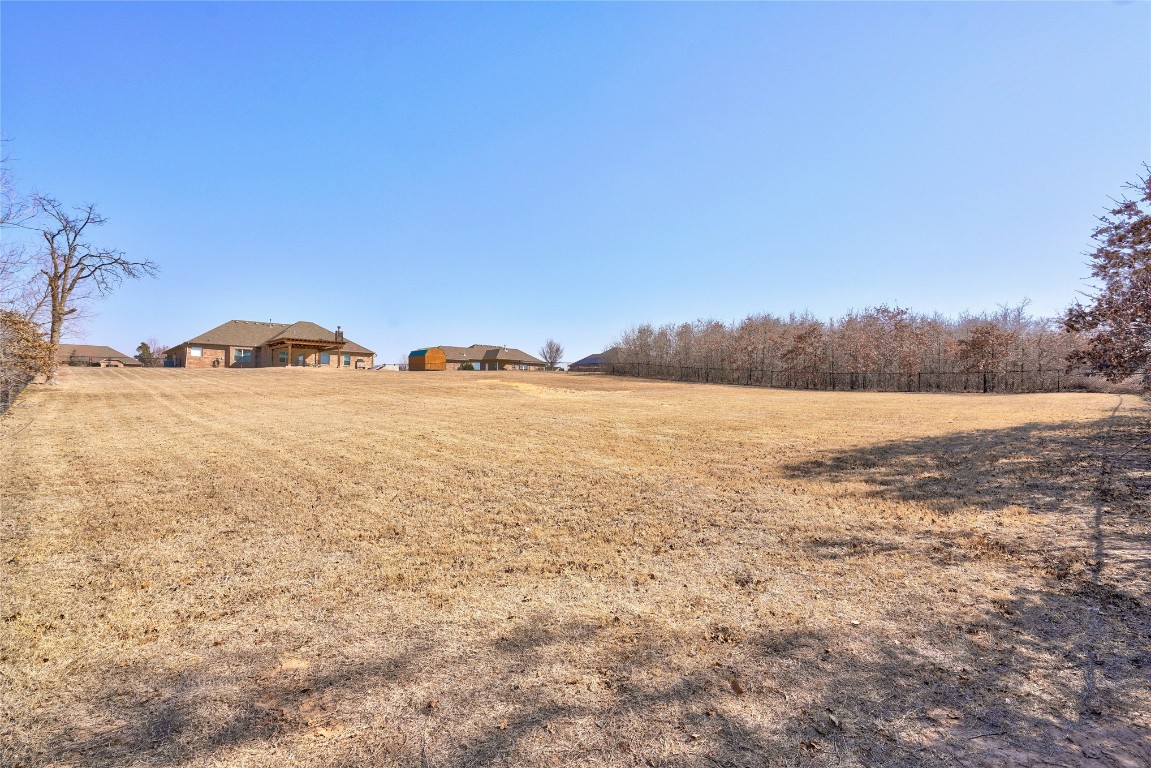 145 Oakridge Drive, Choctaw, OK 73020 view of yard featuring a rural view