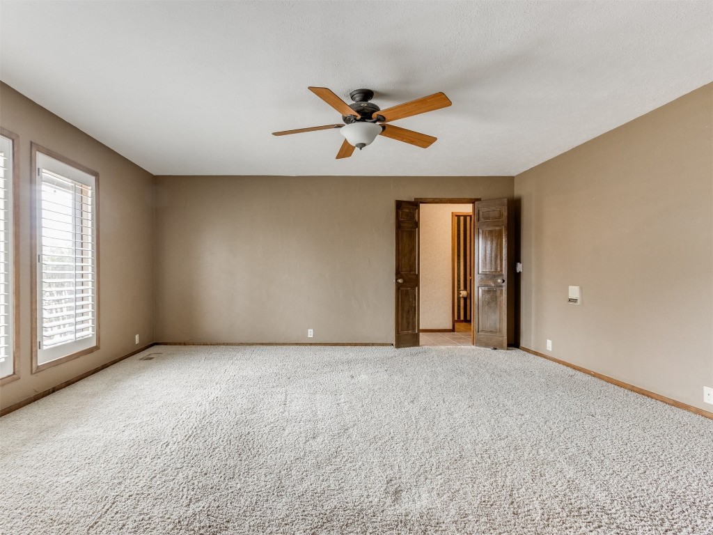 10717 Woodridden, Oklahoma City, OK 73170 carpeted empty room featuring ceiling fan