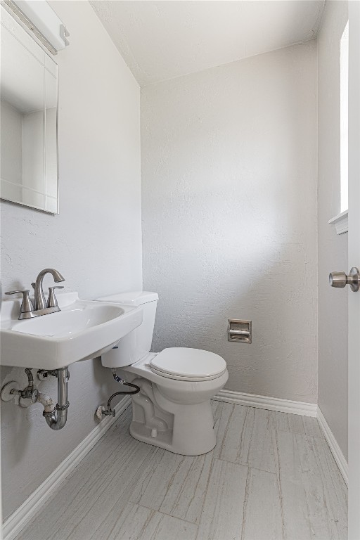 6004 S Dewey Avenue, Oklahoma City, OK 73139 bathroom with tile flooring and toilet