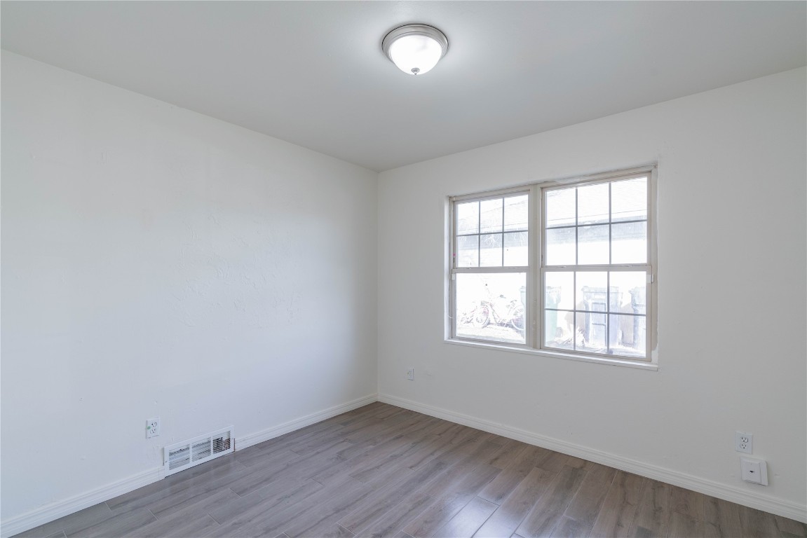 1417 NW 102nd Street, Oklahoma City, OK 73114 empty room featuring light hardwood / wood-style flooring