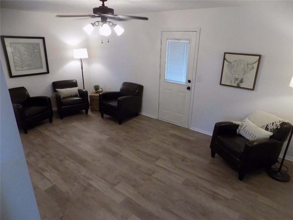 2706 CS 2831, Chickasha, OK 73018 living area featuring ceiling fan and dark hardwood / wood-style floors