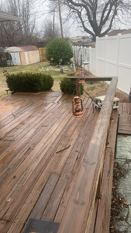 208 E Key Boulevard, Midwest City, OK 73110 wooden deck with a storage shed
