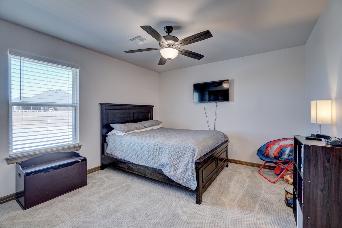 5851 Starry Night, Piedmont, OK 73078 carpeted bedroom with ceiling fan