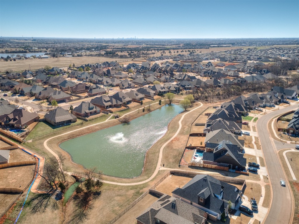 14504 Chambord Drive, Yukon, OK 73099 drone / aerial view featuring a water view