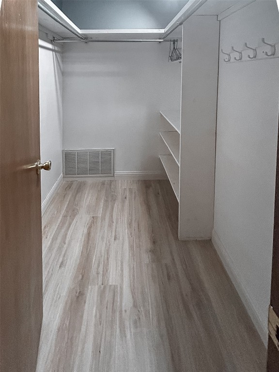805 SW 67th Street, Oklahoma City, OK 73139 spacious closet featuring light hardwood / wood-style floors