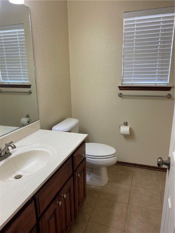 717 SW 161st Street, Oklahoma City, OK 73170 bathroom featuring tile flooring, toilet, and vanity