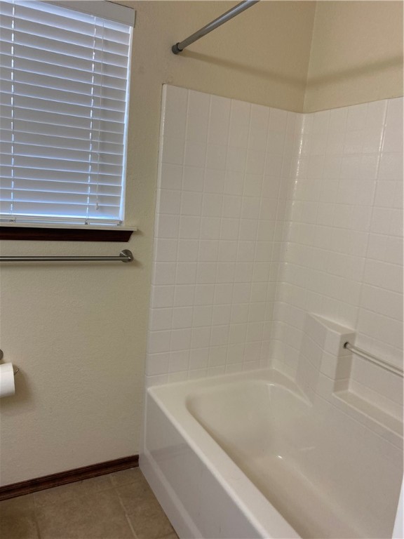 717 SW 161st Street, Oklahoma City, OK 73170 bathroom featuring tile floors and shower / bathtub combination