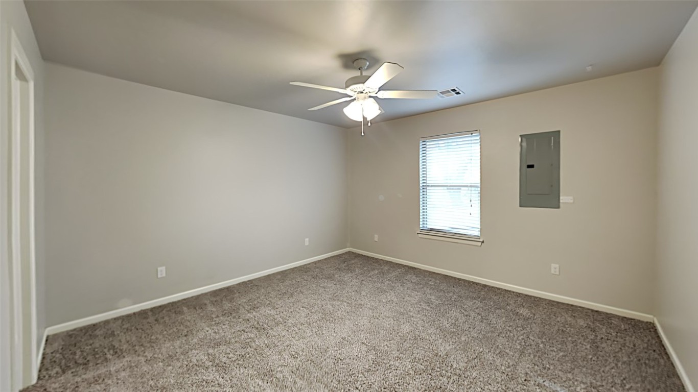 8914 Oak Valley Drive, Midwest City, OK 73110 spare room with carpet floors and ceiling fan