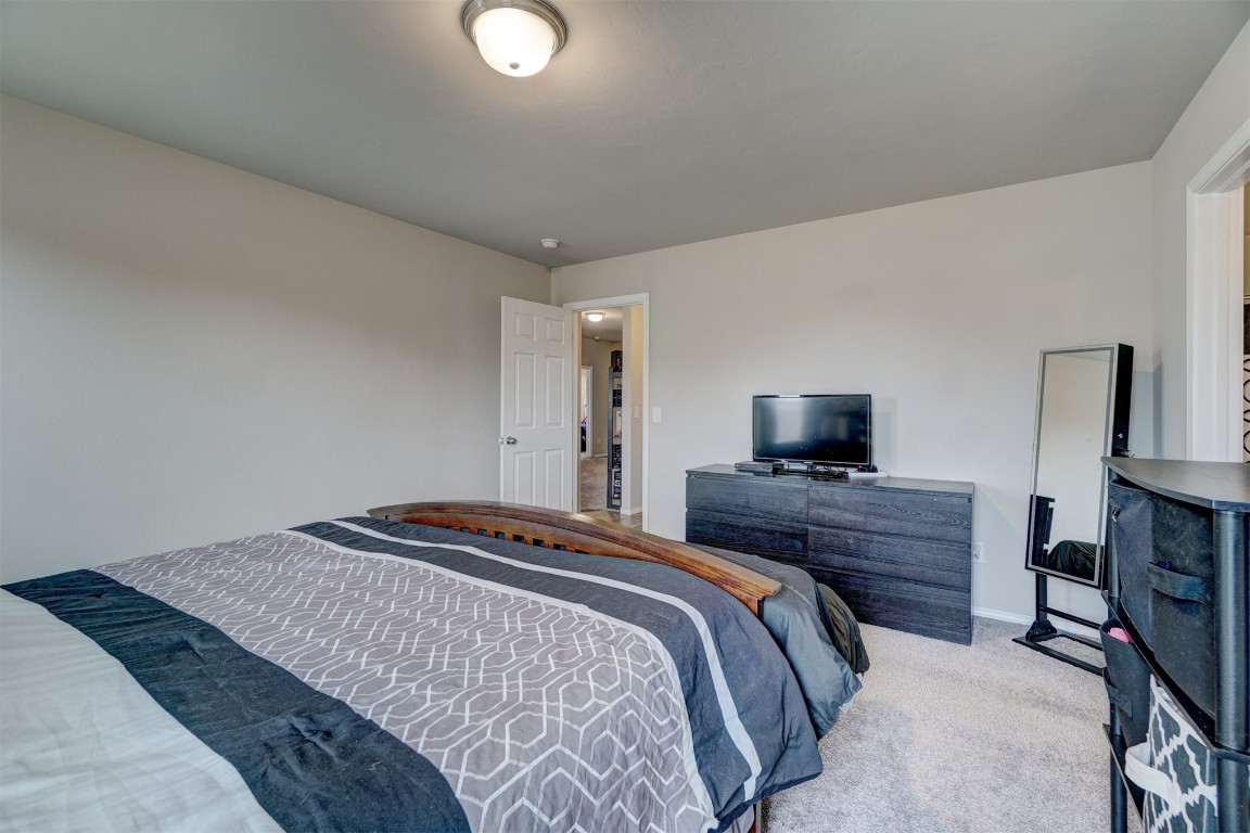 1316 Peridot Lane, Noble, OK 73068 bedroom featuring light colored carpet