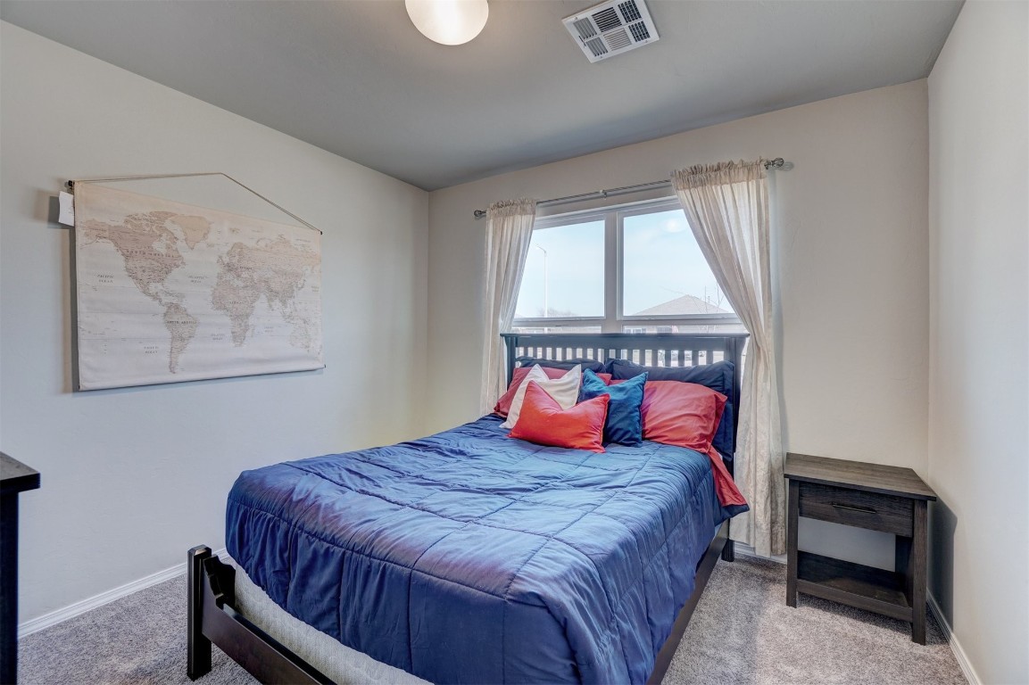1316 Peridot Lane, Noble, OK 73068 bedroom featuring light colored carpet