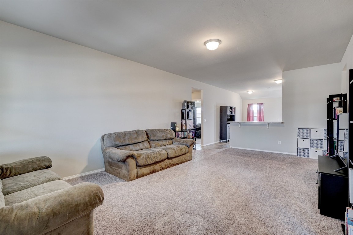 1316 Peridot Lane, Noble, OK 73068 living room featuring light colored carpet