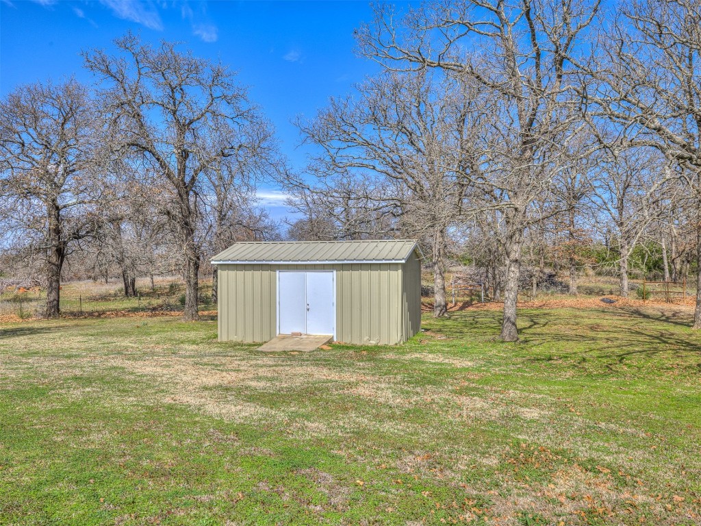 14051 Cemetery Road, Noble, OK 73068 exterior space featuring a storage shed