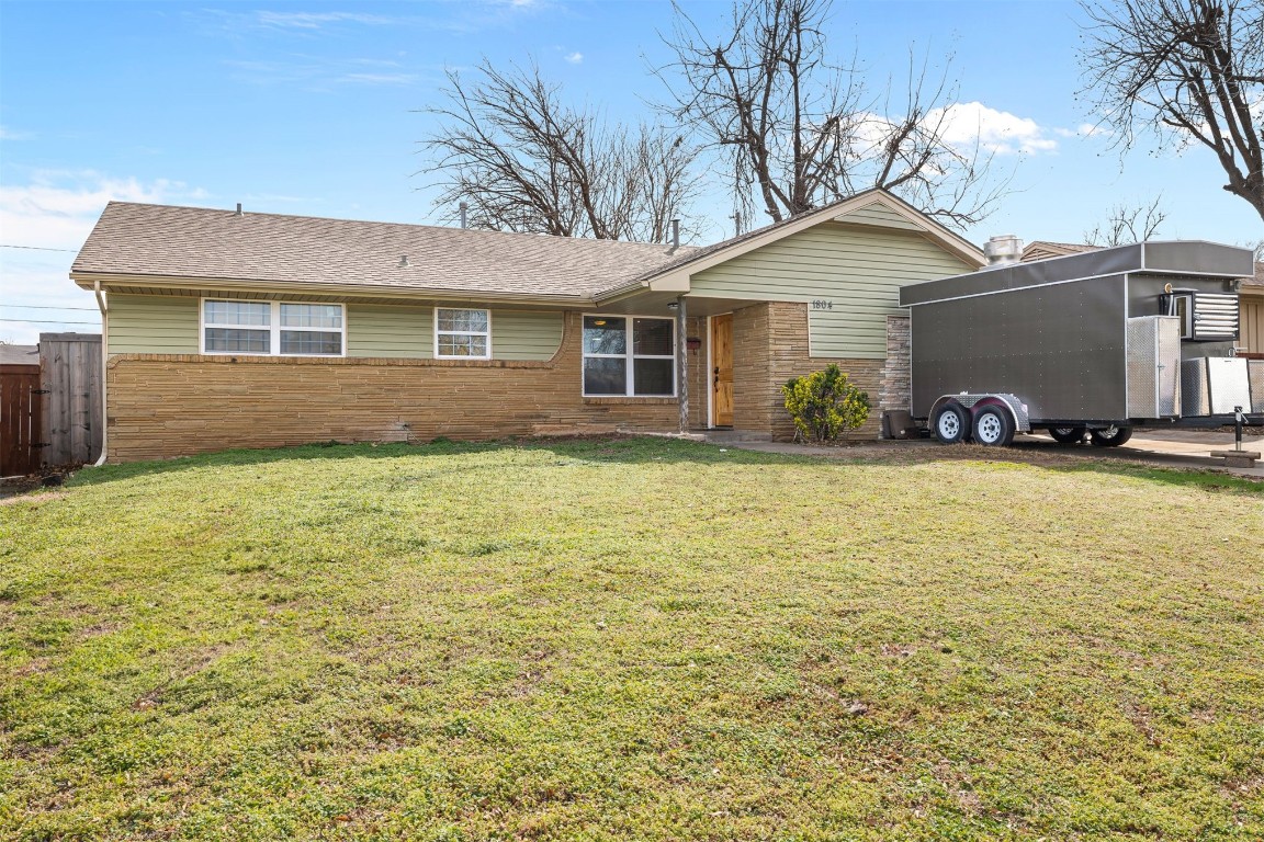 1804 NE 53rd Street, Oklahoma City, OK 73111 single story home featuring a front yard