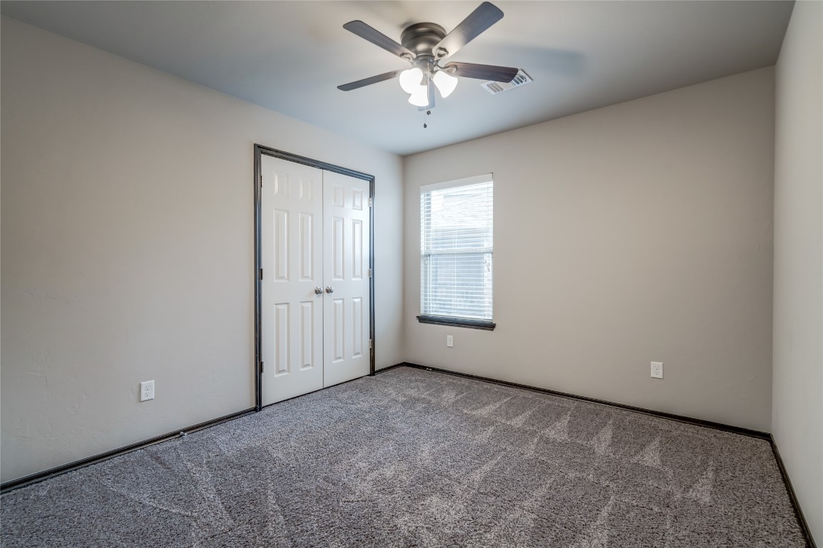 2561 NW 186th Street, Edmond, OK 73012 unfurnished room featuring carpet floors and ceiling fan