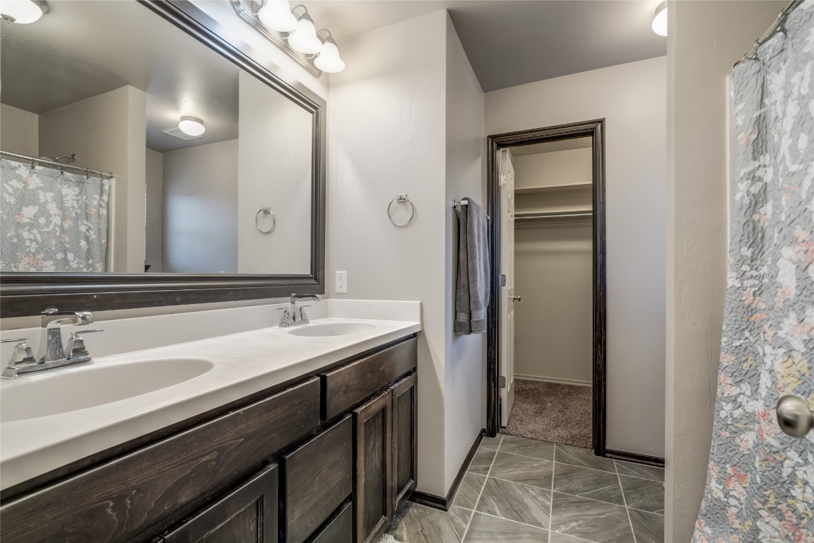 2561 NW 186th Street, Edmond, OK 73012 bathroom featuring tile flooring and dual vanity