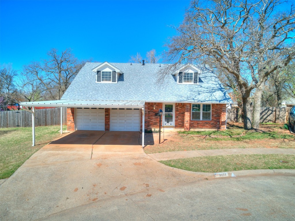 3421 Simmons Drive, Del City, OK 73115 cape cod home featuring a garage and a front yard