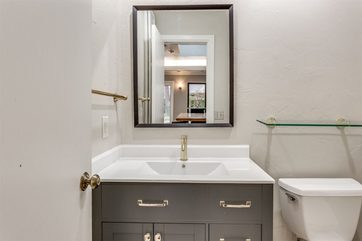 3904 Spyglass Road, Oklahoma City, OK 73120 bathroom with toilet and large vanity