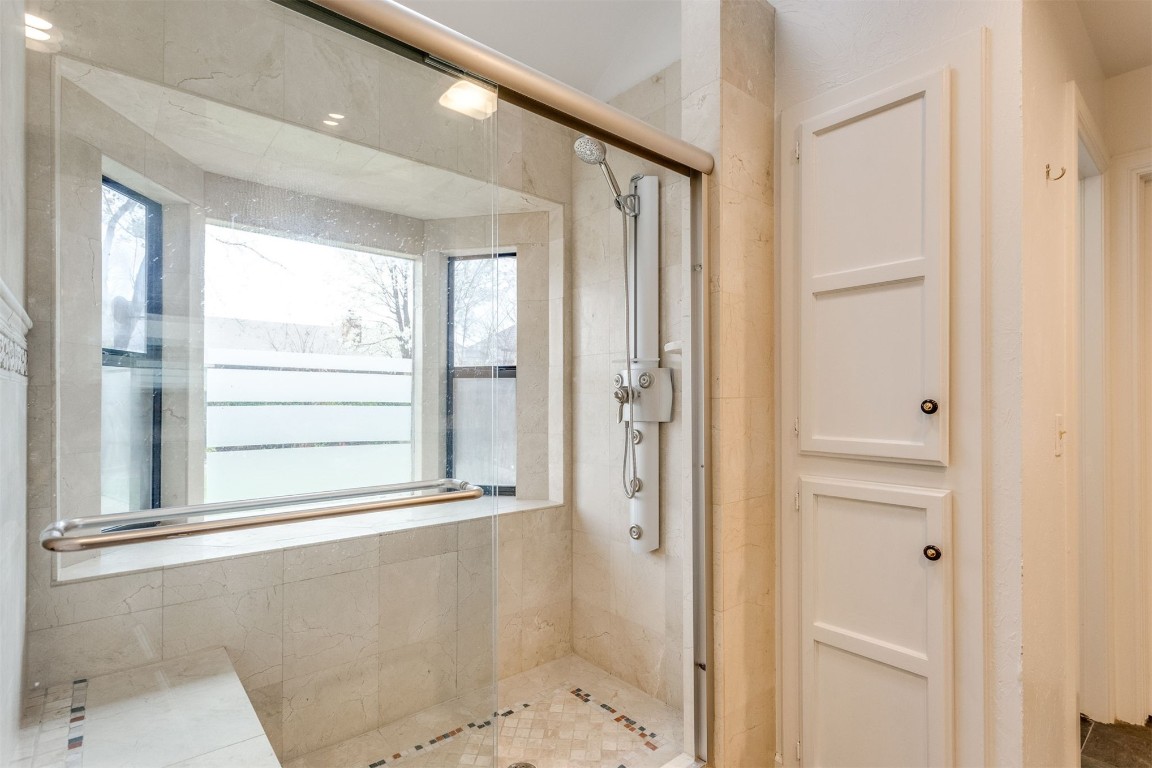 3904 Spyglass Road, Oklahoma City, OK 73120 bathroom featuring a shower with shower door