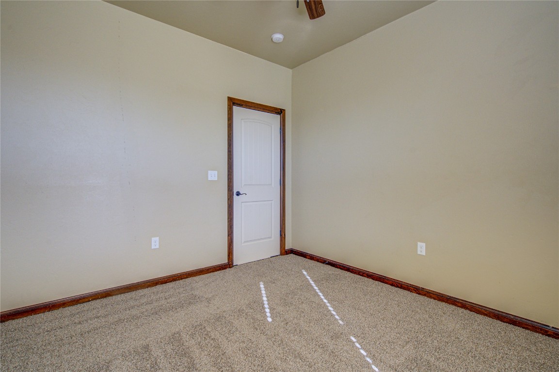 1808 Palomino Drive, Blanchard, OK 73010 carpeted empty room featuring ceiling fan