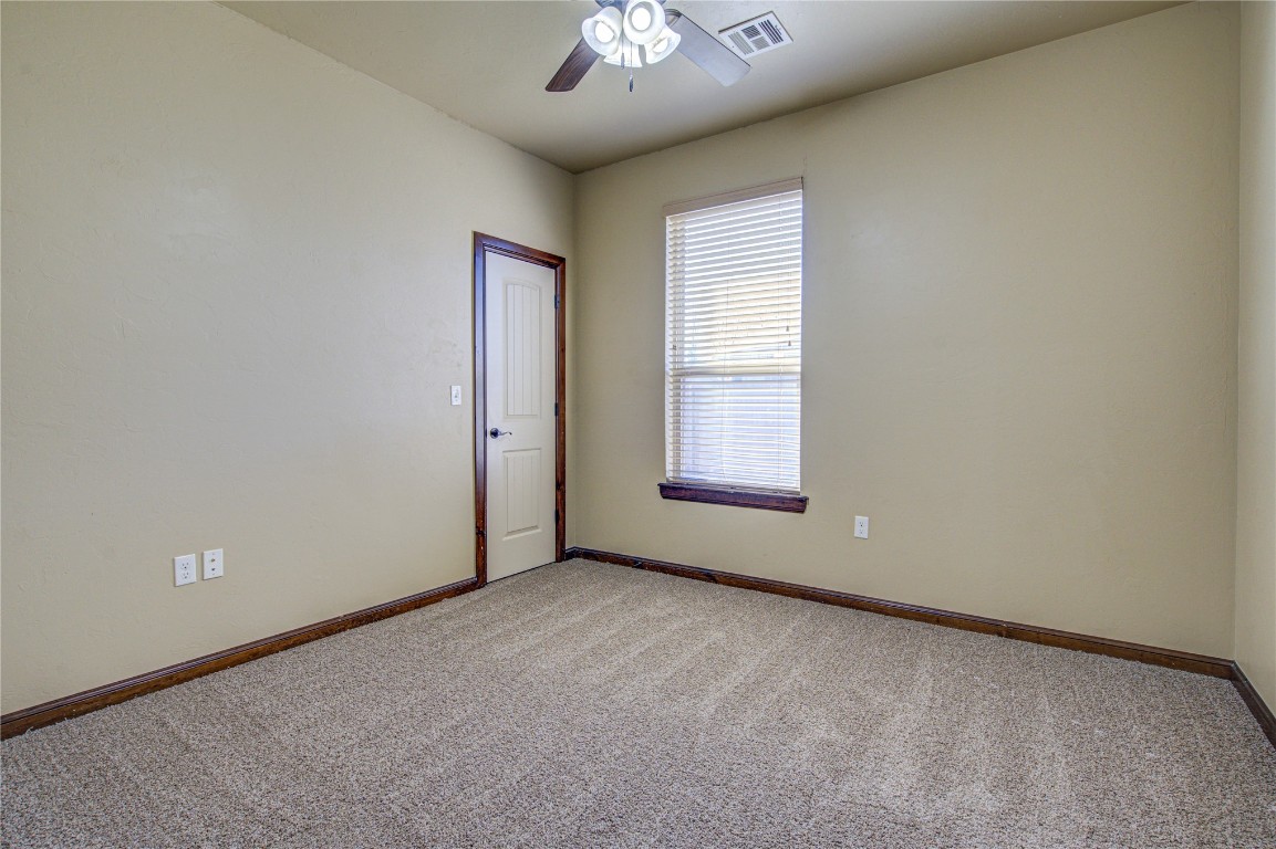 1808 Palomino Drive, Blanchard, OK 73010 carpeted spare room with ceiling fan
