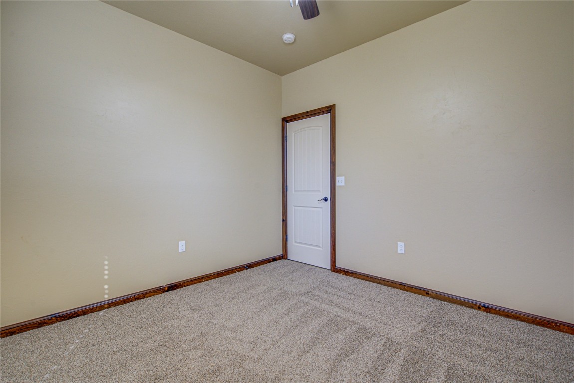 1808 Palomino Drive, Blanchard, OK 73010 unfurnished room with carpet floors and ceiling fan