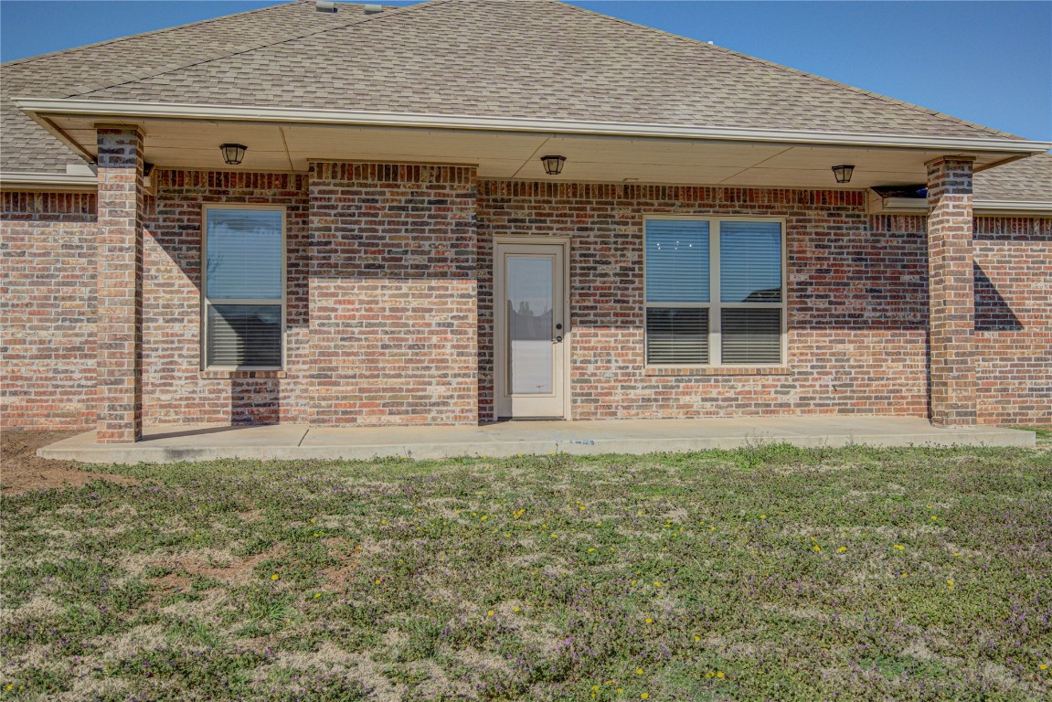 1808 Palomino Drive, Blanchard, OK 73010 exterior space featuring a patio and a yard