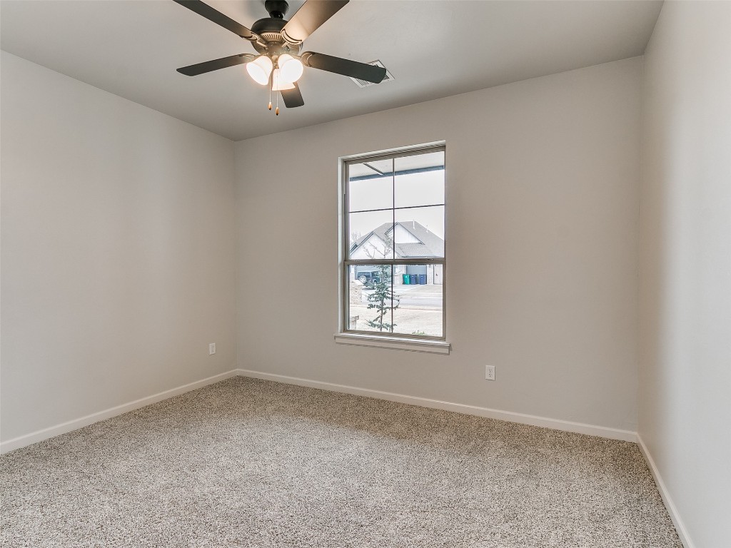 12105 SW 51st Street, Mustang, OK 73064 unfurnished room featuring light colored carpet and ceiling fan