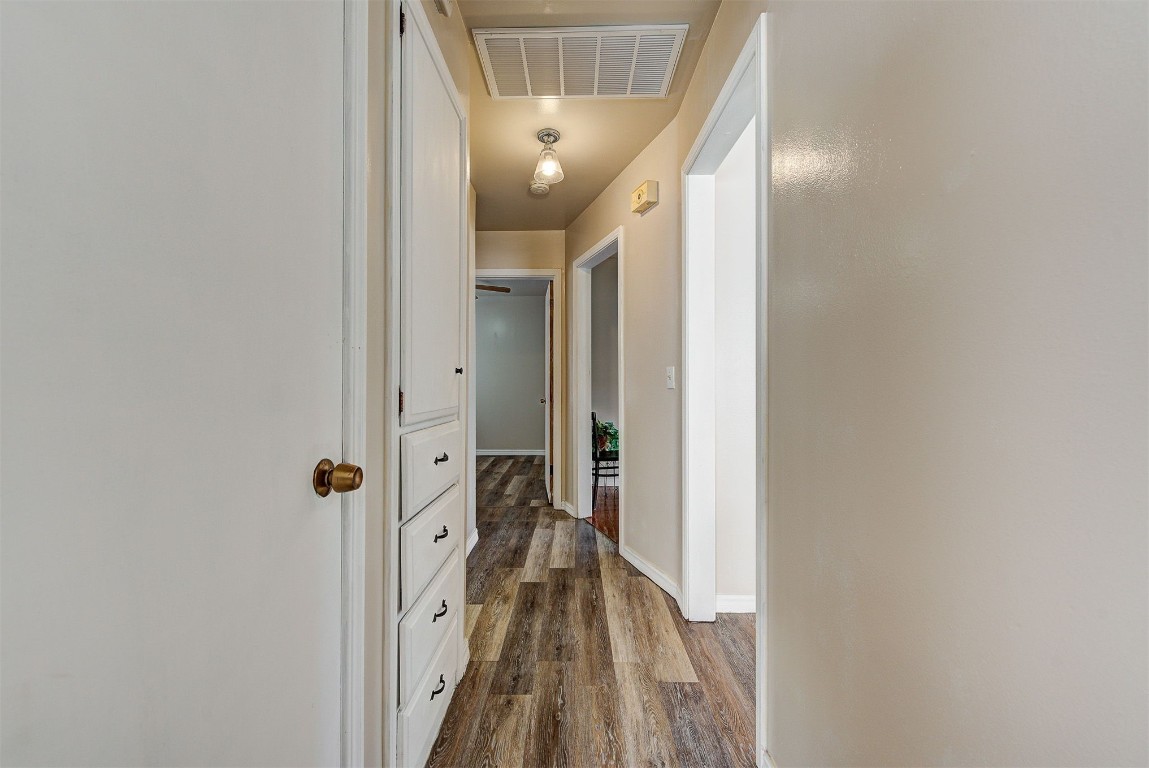 3022 NW 20th Street, Oklahoma City, OK 73107 hallway with dark wood-type flooring