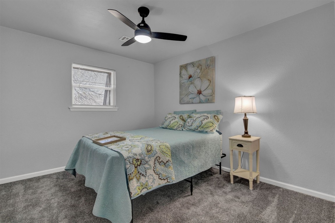 3012 Robin Road, Midwest City, OK 73110 carpeted bedroom with ceiling fan