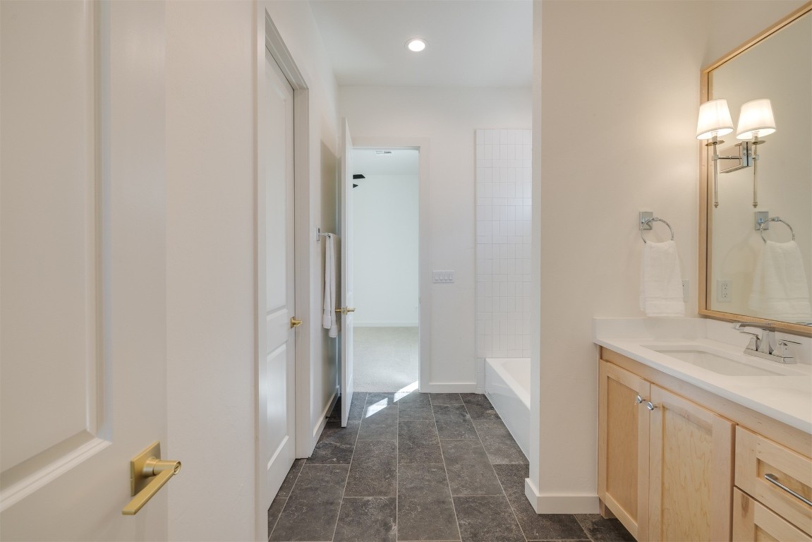 7124 Sunset Sail Avenue, Edmond, OK 73034 bathroom with vanity and tile floors