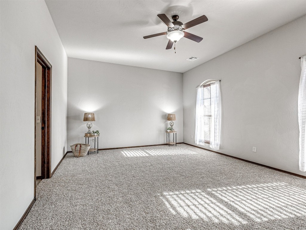 13512 Borgata Lane, Oklahoma City, OK 73170 carpeted spare room with ceiling fan