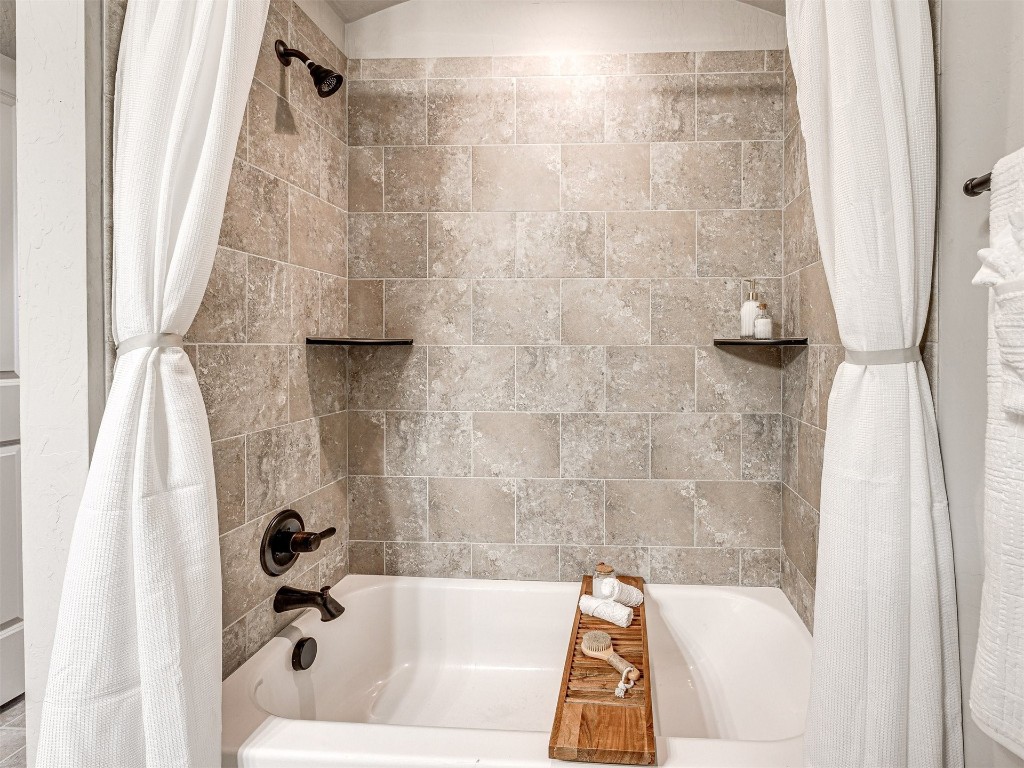 13512 Borgata Lane, Oklahoma City, OK 73170 bathroom featuring shower / tub combo