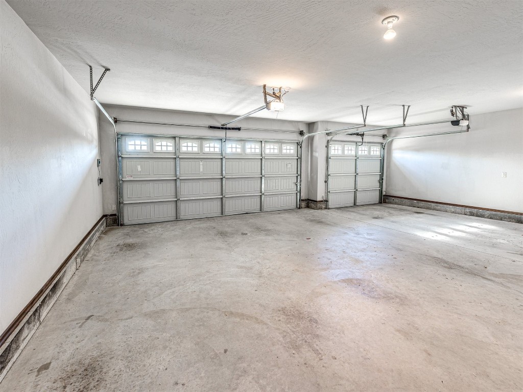 13512 Borgata Lane, Oklahoma City, OK 73170 garage featuring a garage door opener