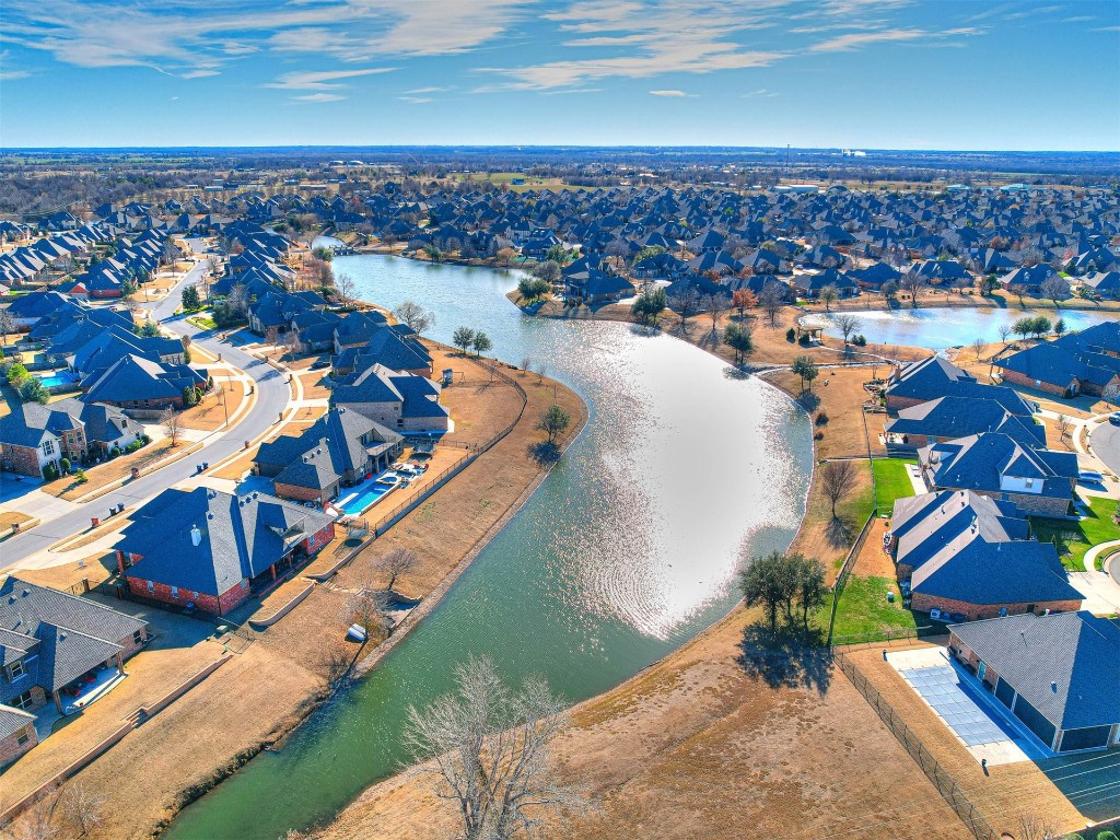 13512 Borgata Lane, Oklahoma City, OK 73170 aerial view with a water view
