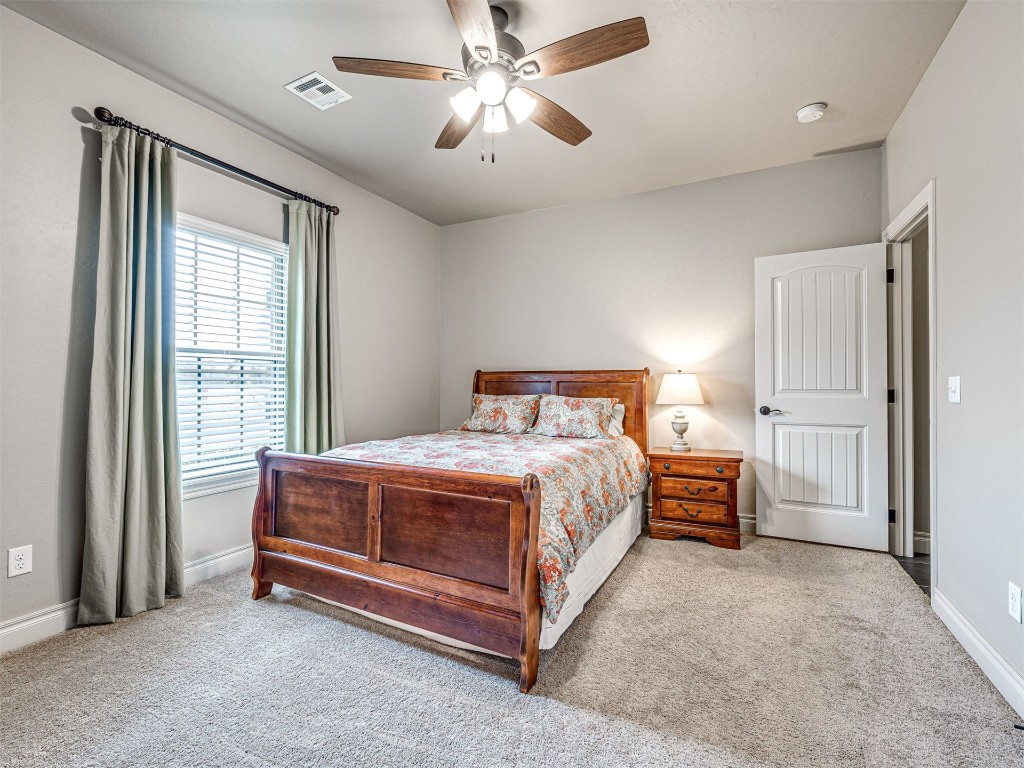 12600 SW 24th Street, Yukon, OK 73099 carpeted bedroom with ceiling fan