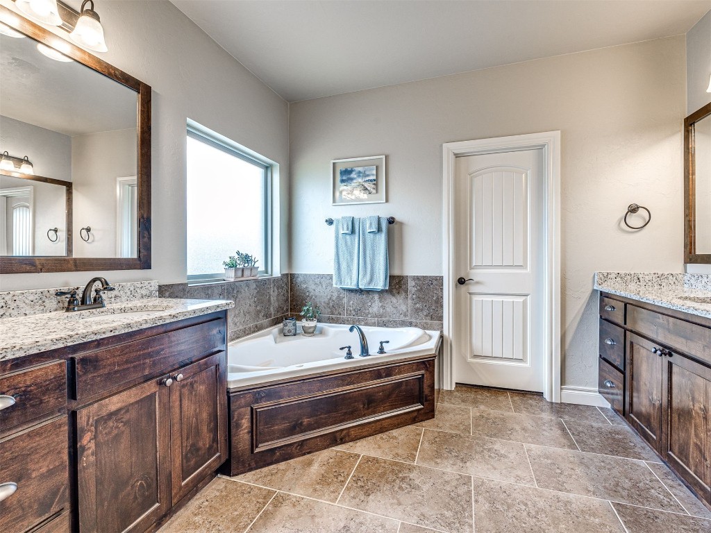 12600 SW 24th Street, Yukon, OK 73099 bathroom with tile floors, vanity, and a bathtub