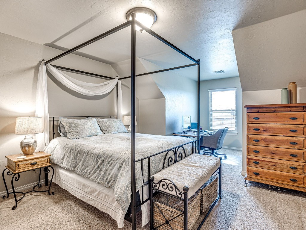 12600 SW 24th Street, Yukon, OK 73099 bedroom with light colored carpet