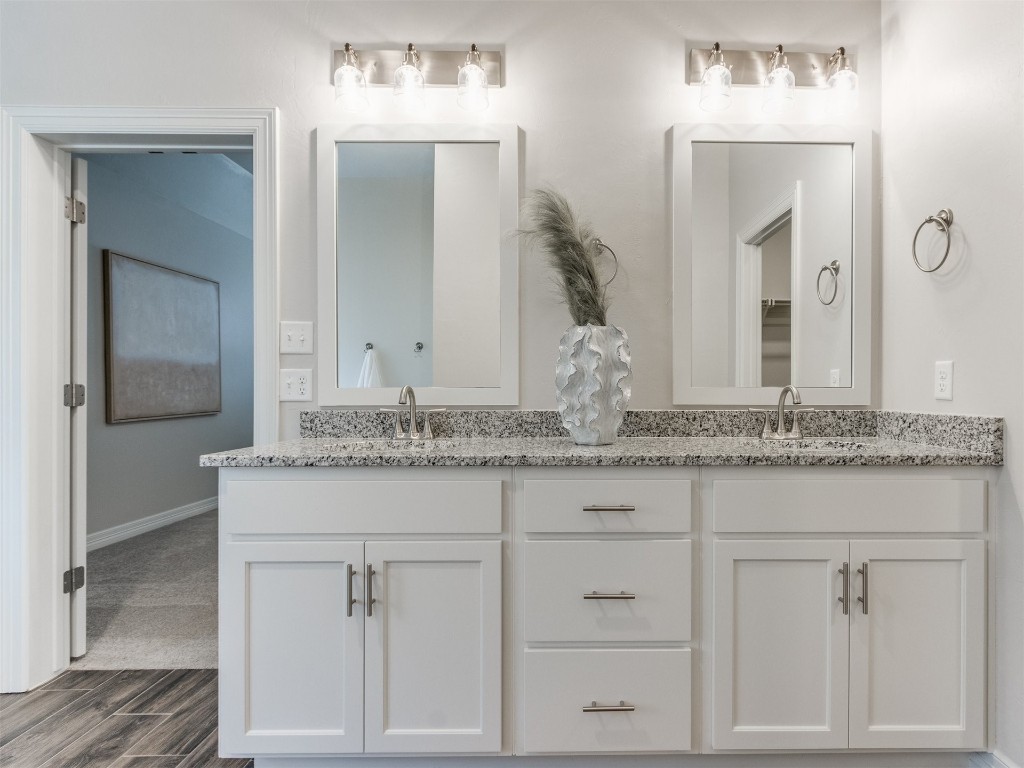 16200 Brenton Hills Avenue, Edmond, OK 73013 bathroom featuring oversized vanity and double sink