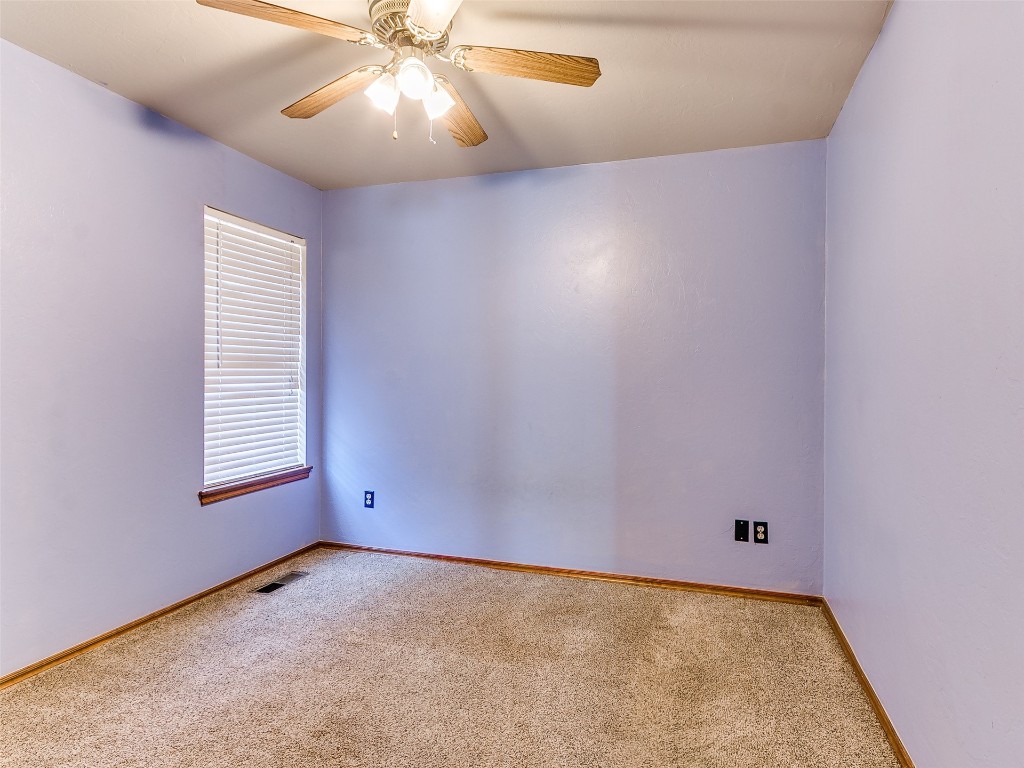 1013 SW 126th Street, Oklahoma City, OK 73170 carpeted spare room with ceiling fan